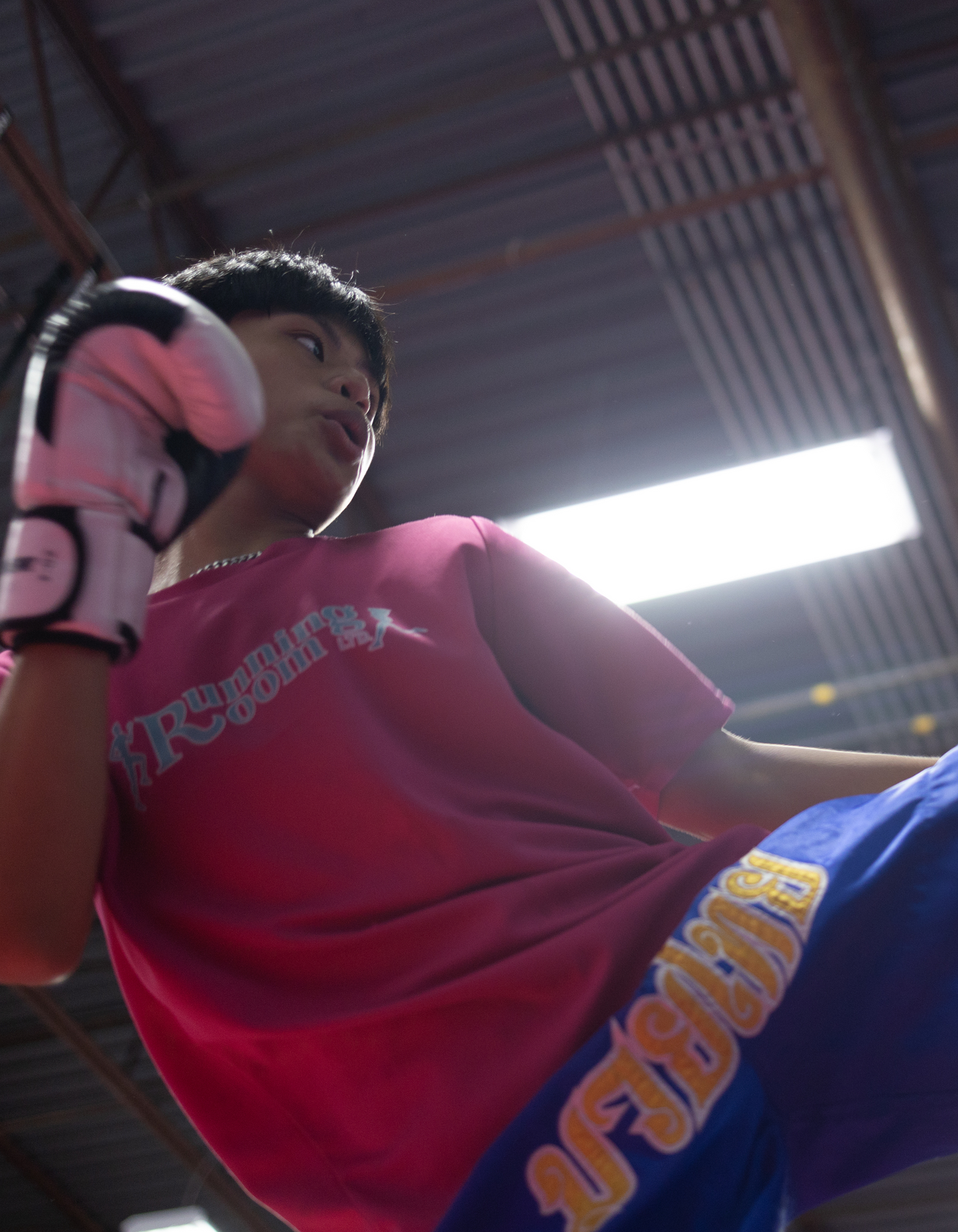 Kids Muay Thai classes boy kicking bag at Ultimate Martial Arts & Fitness gym (Mississauga, GTA, Ontario, Canada)